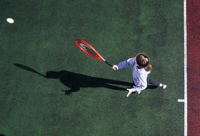 130321 Golf and Tennis return in Wales - Sara Davies, aged 10 from Cardiff, has her first tennis lesson in over 3 months from Head Coach Melissa Davies at Whitchurch Tennis Club in Cardiff on the day that lockdown restrictions were eased in Wales for outside sports including golf and tennis