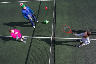 130321 Golf and Tennis return in Wales - The Davies family from Cardiff, enjoy their first tennis session in over 3 months at Whitchurch Tennis Club in Cardiff on the day that lockdown restrictions were eased in Wales for outside sports including golf and tennis