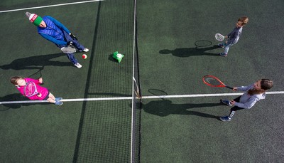 130321 Golf and Tennis return in Wales - The Davies family from Cardiff, enjoy their first tennis session in over 3 months at Whitchurch Tennis Club in Cardiff on the day that lockdown restrictions were eased in Wales for outside sports including golf and tennis