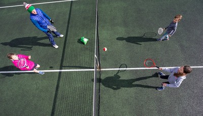 130321 Golf and Tennis return in Wales - The Davies family from Cardiff, enjoy their first tennis session in over 3 months at Whitchurch Tennis Club in Cardiff on the day that lockdown restrictions were eased in Wales for outside sports including golf and tennis