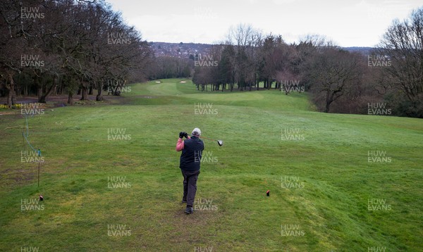 130321 Golf returns in Wales - One of the first players to take to the course plays a shot at Cardiff Golf Club on the day that lockdown restrictions were eased in Wales for outside sports including golf and tennis