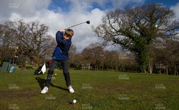 130321 Golf returns in Wales - One of the first players to take to the course, Fred Dineen, aged 12 from Cardiff, plays a shot at Cardiff Golf Club on the day that lockdown restrictions were eased in Wales for outside sports including golf and tennis