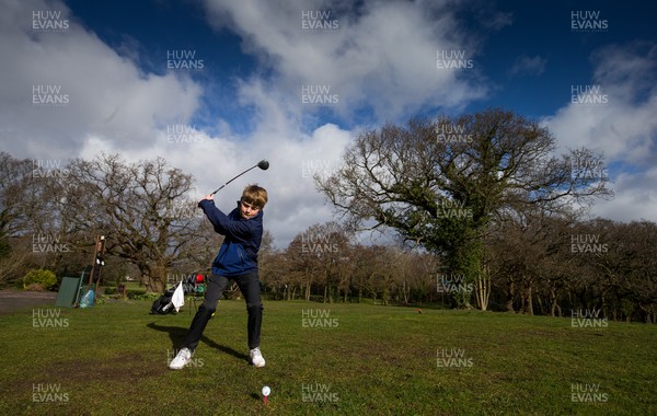 130321 Golf returns in Wales - One of the first players to take to the course, Fred Dineen, aged 12 from Cardiff, plays a shot at Cardiff Golf Club on the day that lockdown restrictions were eased in Wales for outside sports including golf and tennis