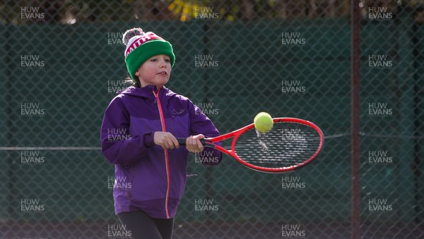 130321 Golf and Tennis return in Wales - Sara Davies, aged 10 from Cardiff, has her first tennis lesson in over 3 months from Head Coach Melissa Davies at Whitchurch Tennis Club in Cardiff on the day that lockdown restrictions were eased in Wales for outside sports including golf and tennis
