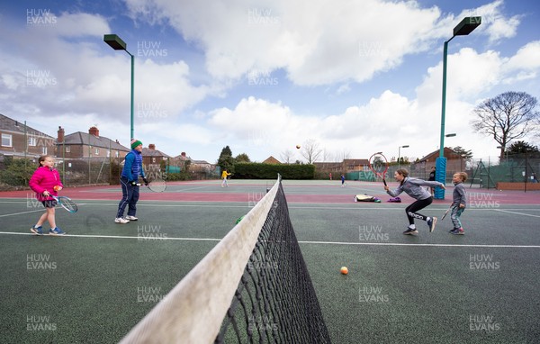 130321 Golf and Tennis return in Wales - The Davies family from Cardiff, enjoy their first tennis session in over 3 months at Whitchurch Tennis Club in Cardiff on the day that lockdown restrictions were eased in Wales for outside sports including golf and tennis