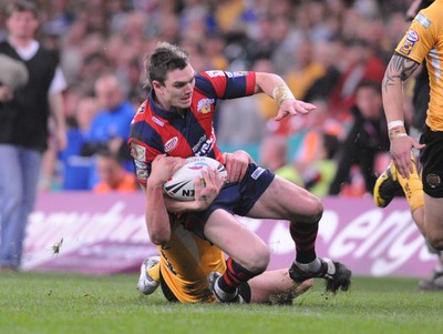 03.04.08 - Millennium Magic 2008 Rugby League Castleford Tigers v Wakefield Trinity Wildcats Wildcats Danny Brough is brought down 