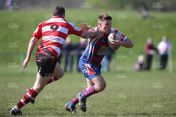 080417 - Tondu RFC v Cwmgors RFC - League 2 West Central Gareth Linden Burn hands off his opposite number for Cwmgors  