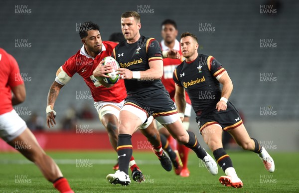 160617 - Tonga v Wales - American Express Pasifika Challenge - Scott Williams of Wales is tackled by Valentino Mapapalangi of Tonga