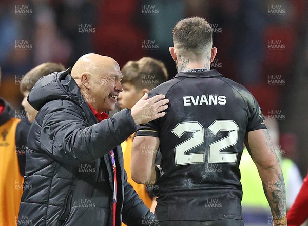 241022 - Tonga v Wales - Rugby League World Cup 2021 - Wales Rugby League Coach John Kear and Kyle Evans of Wales Rugby League at the end of the match