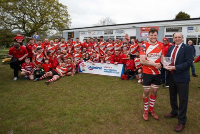 270424 - Tonna RFC v Glyncorrwg RFC - Admiral National League 4 West Central - WRU representative Kerry Frey presents the trophy to Callum McPhee of Tonna RFC