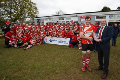 270424 - Tonna RFC v Glyncorrwg RFC - Admiral National League 4 West Central - WRU representative Kerry Frey presents the trophy to Callum McPhee of Tonna RFC