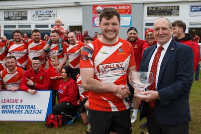 270424 - Tonna RFC v Glyncorrwg RFC - Admiral National League 4 West Central - WRU representative Kerry Frey presents the trophy to Callum McPhee of Tonna RFC