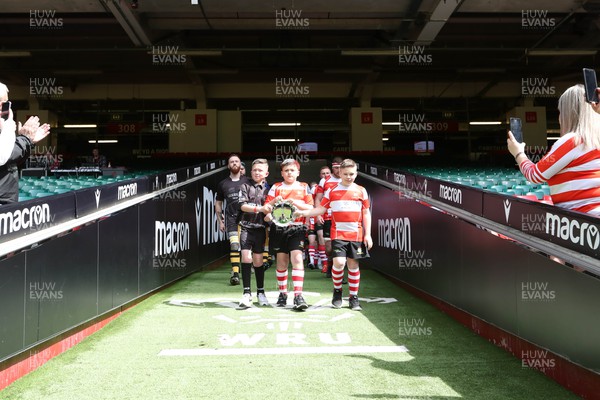 300422 - Tonna v Crumlin - WRU National Shield Final -  Mascots lead the teams out with the trophy