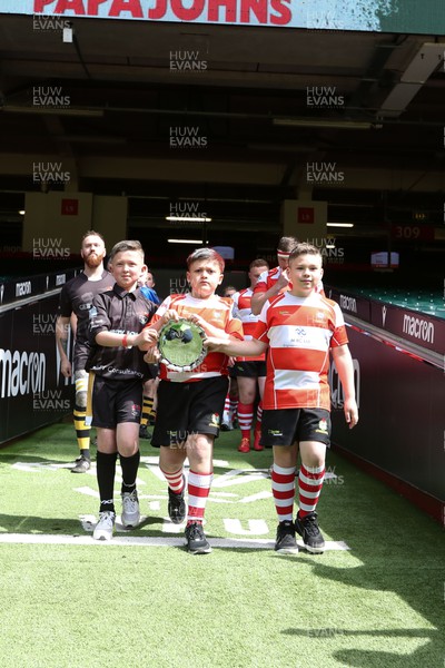 300422 - Tonna v Crumlin - WRU National Shield Final -   Mascots lead the teams out with the trophy