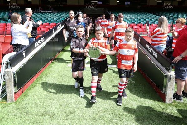300422 - Tonna v Crumlin - WRU National Shield Final -  Mascots lead the teams out with the trophy