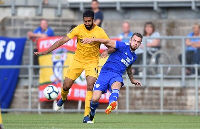 200718 - Torquay v Cardiff City - Preseason Friendly - Samir Nabi of Torquay is tackled by Joe Ralls of Cardiff City