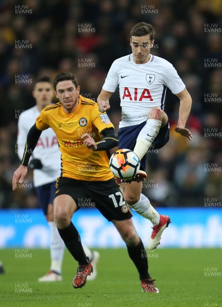 070218 - Tottenham Hotspur v Newport County, FA Cup Round 4 Replay - Harry Winks of Tottenham Hotspur wins the ball from  Ben Tozer of Newport County