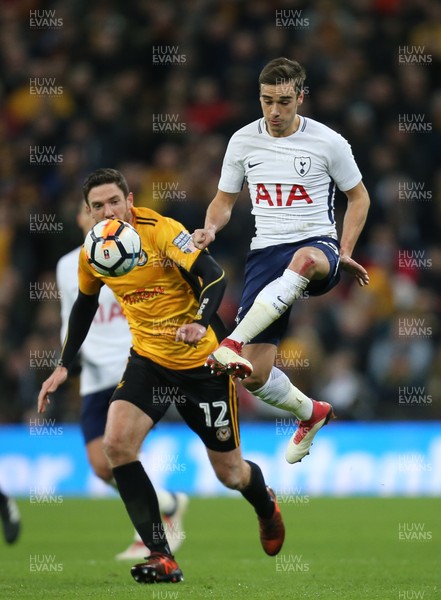 070218 - Tottenham Hotspur v Newport County, FA Cup Round 4 Replay - Harry Winks of Tottenham Hotspur wins the ball from  Ben Tozer of Newport County