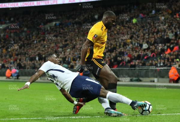 070218 - Tottenham Hotspur v Newport County, FA Cup Round 4 Replay - Frank Nouble of Newport County avoids the challenge from Serge Aurier of Tottenham Hotspur