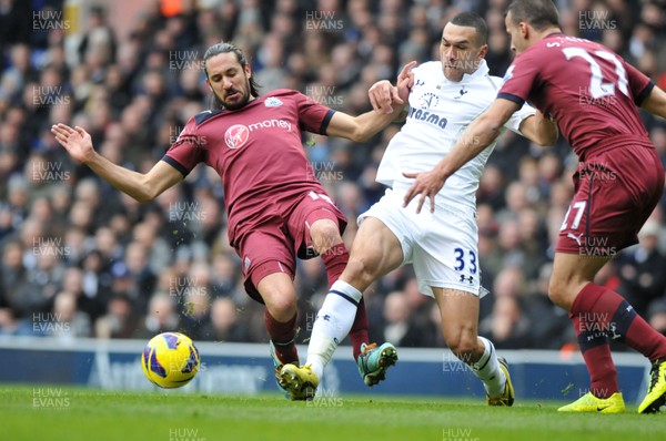 090213 Tottenham Hotspur v Newcastle United - Barclays Premier League - Steven Caulker of Spurs is challenged by Newcastle's Jonas Gutierrez 