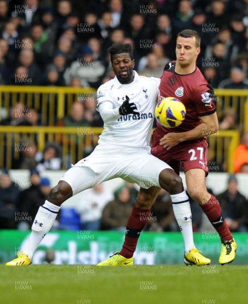 090213 Tottenham Hotspur v Newcastle United - Barclays Premier League - Emmanuel Adebayor of Spurs shields the ball from Steven Taylor of Newcastle 