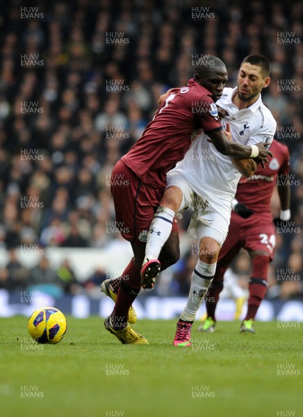 090213 Tottenham Hotspur v Newcastle United - Barclays Premier League - Clint Dempsey gets a foot on the ball past Moussa Sissoko of Newcastle 