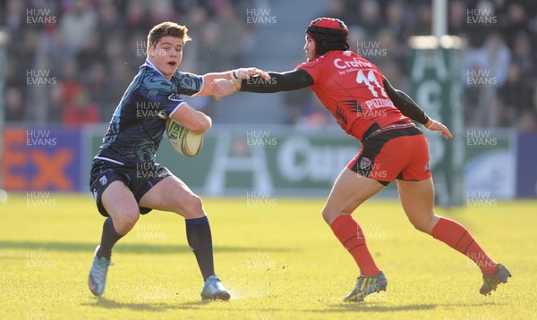 120113 - Toulon v Cardiff Blues - Heineken Cup -Harry Robinson of Cardiff Blues is tackled by Alexis Paulisson of Toulon