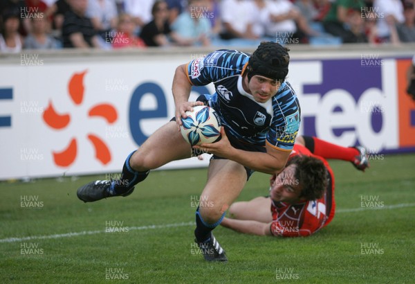 23.05.10...Cardiff Blues v Toulon... Leigh Halfpenny of Cardiff Blues scores try despite tackle by Jeremy Sinzelle of Toulon. 