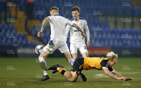 020321 - Tranmere Rovers v Newport County - Sky Bet League 2 - Peter Clarke of Tranmere Rovers steals the ball from Jack Scrimshaw of Newport County