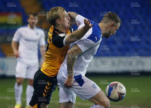 020321 - Tranmere Rovers v Newport County - Sky Bet League 2 - Jack Scrimshaw of Newport County is held by Peter Clarke of Tranmere Rovers