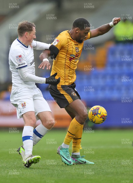 091223 - Tranmere Rovers v Newport County - Sky Bet League 2 - Omar Bogle of Newport County is held by Regan Hendry of Tranmere Rovers