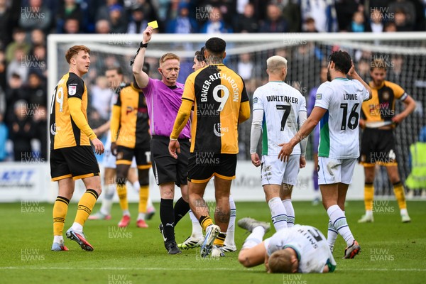 130925 - Tranmere Rovers v Newport County - Sky Bet League 2 - Referee Alan Young gives a yellow card to Courtney Baker-Richardson of Newport County