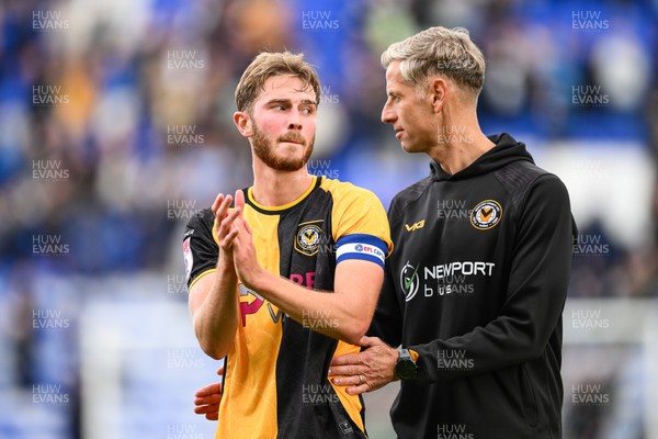 130925 - Tranmere Rovers v Newport County - Sky Bet League 2 - David Hughes, Manager of Newport County, speaks with Matthew Baker of Newport County at the end of the game