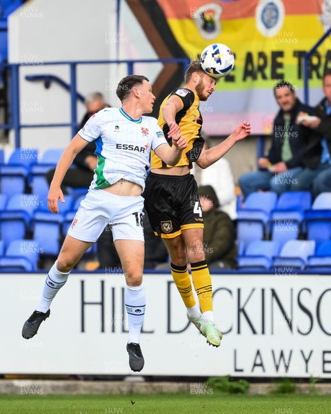 130925 - Tranmere Rovers v Newport County - Sky Bet League 2 - Matthew Baker of Newport County jumps up to win the high ball