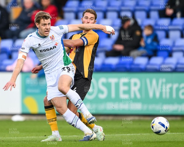 130925 - Tranmere Rovers v Newport County - Sky Bet League 2 - Matthew Baker of Newport County and Joe Ironside of Tranmere Rovers battle for the ball