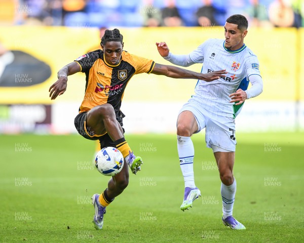 130925 - Tranmere Rovers v Newport County - Sky Bet League 2 - Habeeb Ogunneye of Newport County holds off Taylan Harris of Tranmere Rovers