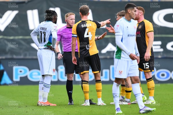 130925 - Tranmere Rovers v Newport County - Sky Bet League 2 - Referee Alan Young speaks to Omari Patrick of Tranmere Rovers and Matthew Baker of Newport County during the game