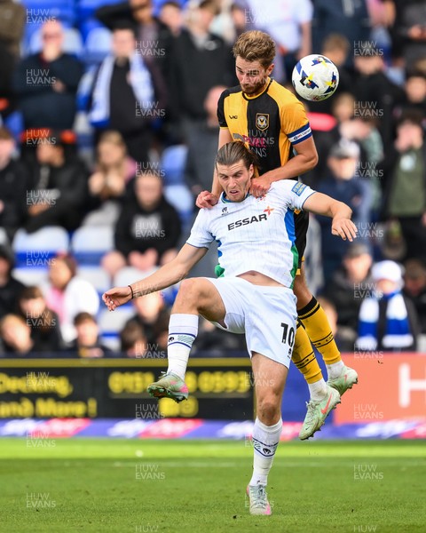 130925 - Tranmere Rovers v Newport County - Sky Bet League 2 - Matthew Baker of Newport County jumps up to win the high ball