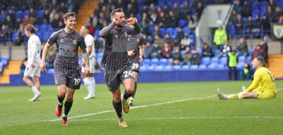 180323 - Tranmere Rovers v Newport County - Sky Bet League 2 - Aaron Wildig of Newport County scores the opening goal…cele with Charlie McNeill of Newport County and Will Evans of Newport County leaving Goalkeeper Joe Murphy of Tranmere Rovers floored