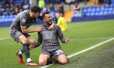 180323 - Tranmere Rovers v Newport County - Sky Bet League 2 - Aaron Wildig of Newport County scores the opening goal…cele with Charlie McNeill of Newport County and Will Evans of Newport County leaving Goalkeeper Joe Murphy of Tranmere Rovers floored