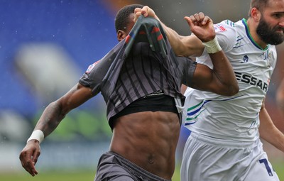 180323 - Tranmere Rovers v Newport County - Sky Bet League 2 - Omar Bogle of Newport County has his shirt`pulled over his head by Jordan Turnbull of Tranmere Rovers 