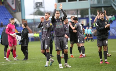 180323 - Tranmere Rovers v Newport County - Sky Bet League 2 - Mickey Demetriou of Newport County leads the team out to applaud the Newport travelling fans