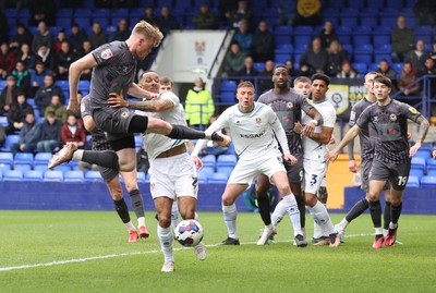 180323 - Tranmere Rovers v Newport County - Sky Bet League 2 - Will Evans of Newport County is crossed by Josh Dacres-Cogley of Tranmere Rovers in the goalmouth