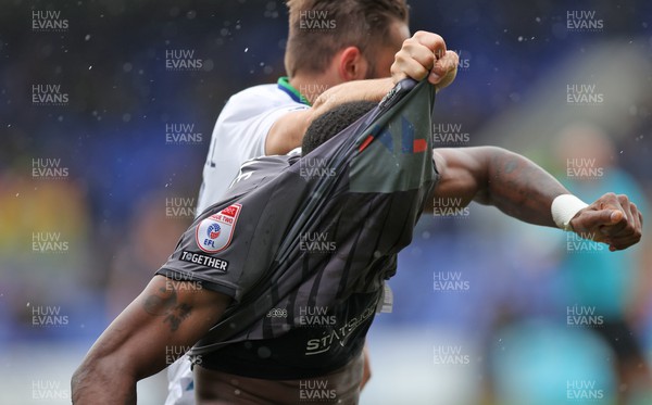 180323 - Tranmere Rovers v Newport County - Sky Bet League 2 - Omar Bogle of Newport County has his shirt`pulled over his head by Jordan Turnbull of Tranmere Rovers 