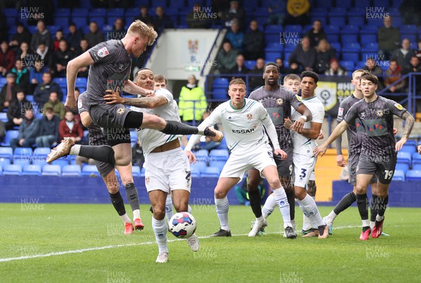 180323 - Tranmere Rovers v Newport County - Sky Bet League 2 - Will Evans of Newport County is crossed by Josh Dacres-Cogley of Tranmere Rovers in the goalmouth