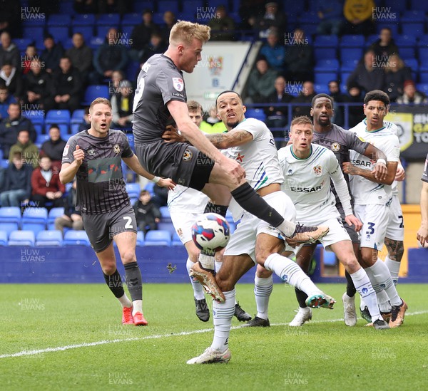 180323 - Tranmere Rovers v Newport County - Sky Bet League 2 - Will Evans of Newport County is crossed by Josh Dacres-Cogley of Tranmere Rovers in the goalmouth