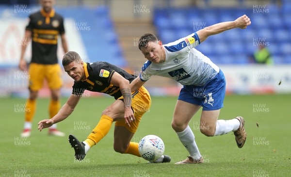 220918 - Tranmere Rovers v Newport County - Sky Bet League 2 - Tyler Hornby-Forbes of Newport County and Connor Jennings of Tranmere Rovers struggle for the ball 