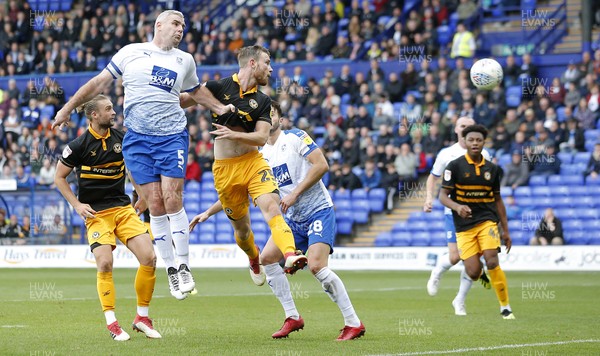 220918 - Tranmere Rovers v Newport County - Sky Bet League 2 - Mark O'Brien of Newport County tries a header on goal despite efforts of Stephen McNulty of Tranmere Rovers