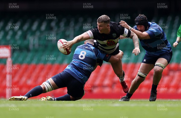 240422 - WRU Championship Plate Final � Trebanos v Bedwas - Lewis Bowden of Bedwas is tackled by Cam Loveys of Trebanos