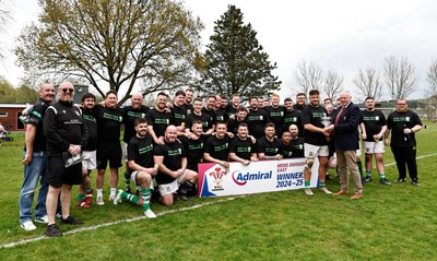 260425 - Tredegar Ironsides v Magor - Admiral National League 5 East - Colin Wilks of the WRU presents the league trophy to club captain Zac Davies